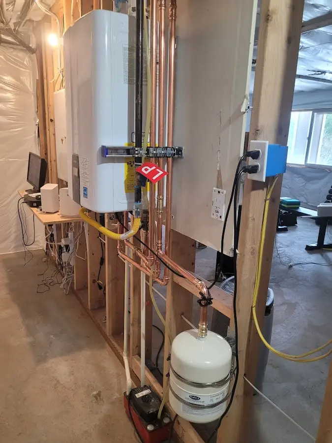Licensed plumber repairing a kitchen sink in Highlands